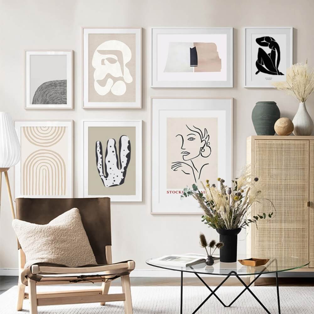 7 modern abstract Scandinavian art painting posters hanging on the wall in an indoor setting, surrounded by lounge room furniture